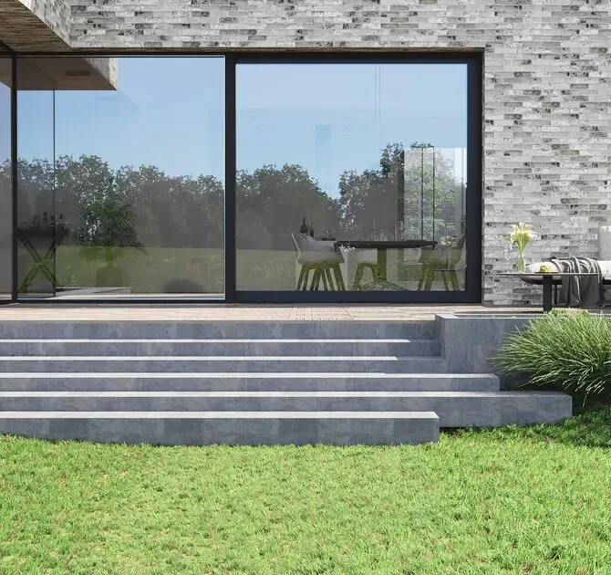 Modern aluminum lift-and-slide door system opening onto a terrace – made-to-measure aluminum systems featured on Custom Aluminum Windows & Doors USA