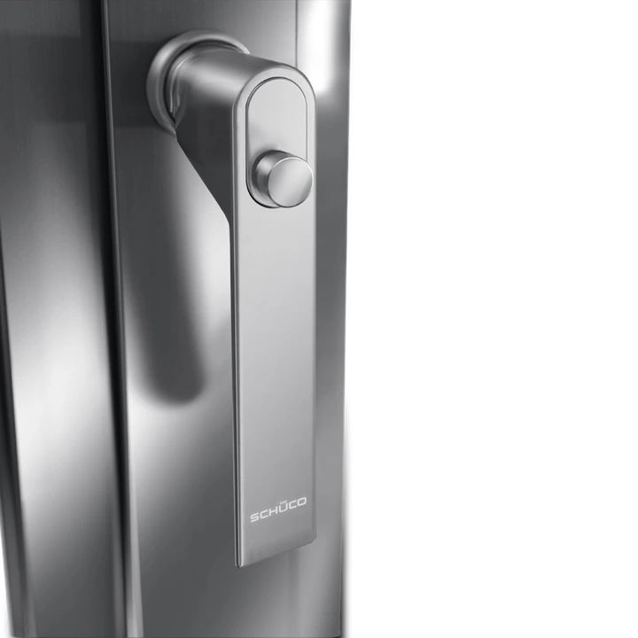 Schüco window handle with push button lock